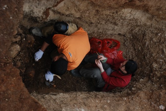 Excavating a secondary multiple burial, Yunnan Province, China 2009