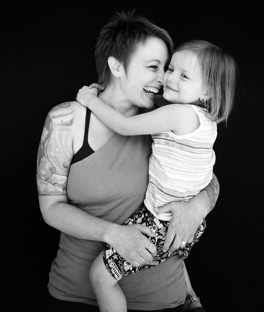 Shannon & Willow - Denver, Colorado. Shannon came to the shoot with what I believe was her partner, and their two children, one of whom was in the arms of her biological father. The three adults had figured out a way to maintain a really healthy relationship with each other, and the kids were ecstatic, beautiful children. People come all the time asking to be photographed with the things that they are most proud of in their lives, so it makes me extremely happy when people bring their beautiful children and show that other than straight parents can do a damn good job too. 