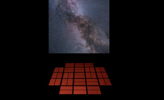 Mock-up of a proposed installation in which live chanting triggers the sounds of the stars. The orange squares are meditation cushions arranged in the shape of the Kepler telescope’s detectors, and the projection is of the star field from which the data originate – near the constellations of Cygnus (the swan) and Lyra (the harp). Image: Lucianne Walkowicz