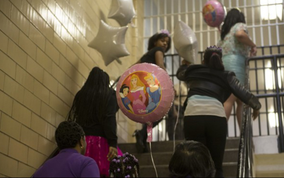 Twelve girls enter the Richmond City Jail for a father-daughter dance. Photo: Marvin Joseph/The Washington Post