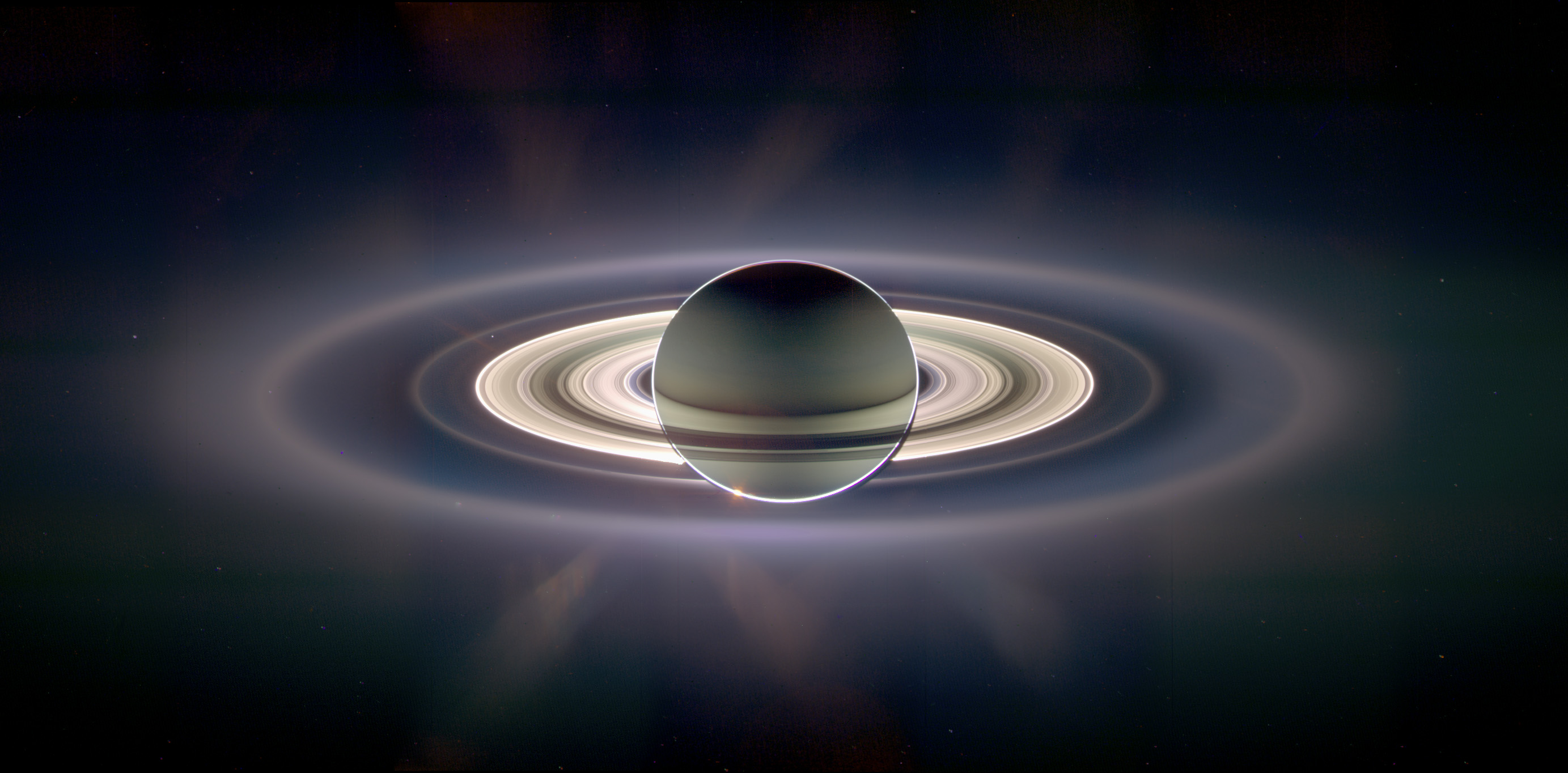 Surprise! The Earth is visible in this image of Saturn during a total eclipse, taken by the Cassini spacecraft. Today, it will take another image.