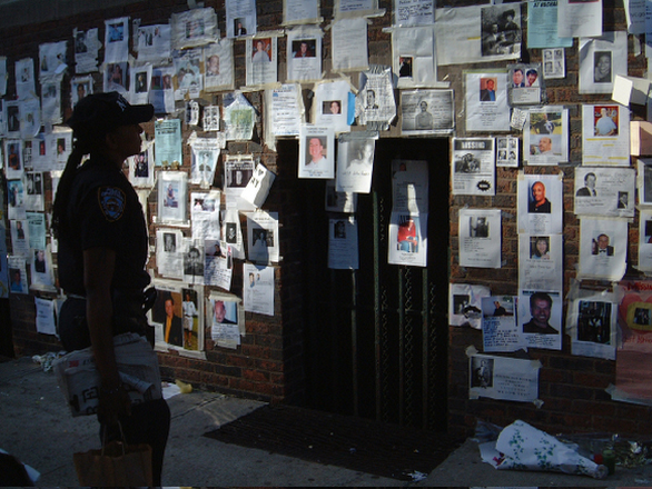 Near the Armory on Lexington Avenue, a policewoman scans the missing person flyers. Submitted by Paul McGeiver.