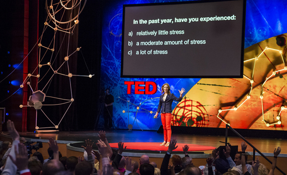 Kelly McGonigal asks the TEDGlobal 2013 audience how much stress they've experienced in the past year. Photo: James Duncan Davidson