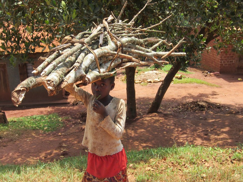 A young girl in Uganda carries wood. It's a sight that changed Sanga Moses' life. Photo: Eco-fuel Africa
