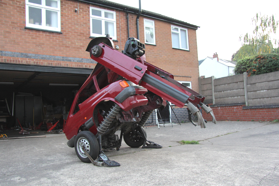 A Ford Fiesta becomes a squatting Transformer in this new sculpture by Hetain Patel. Photo: Hetain Patel