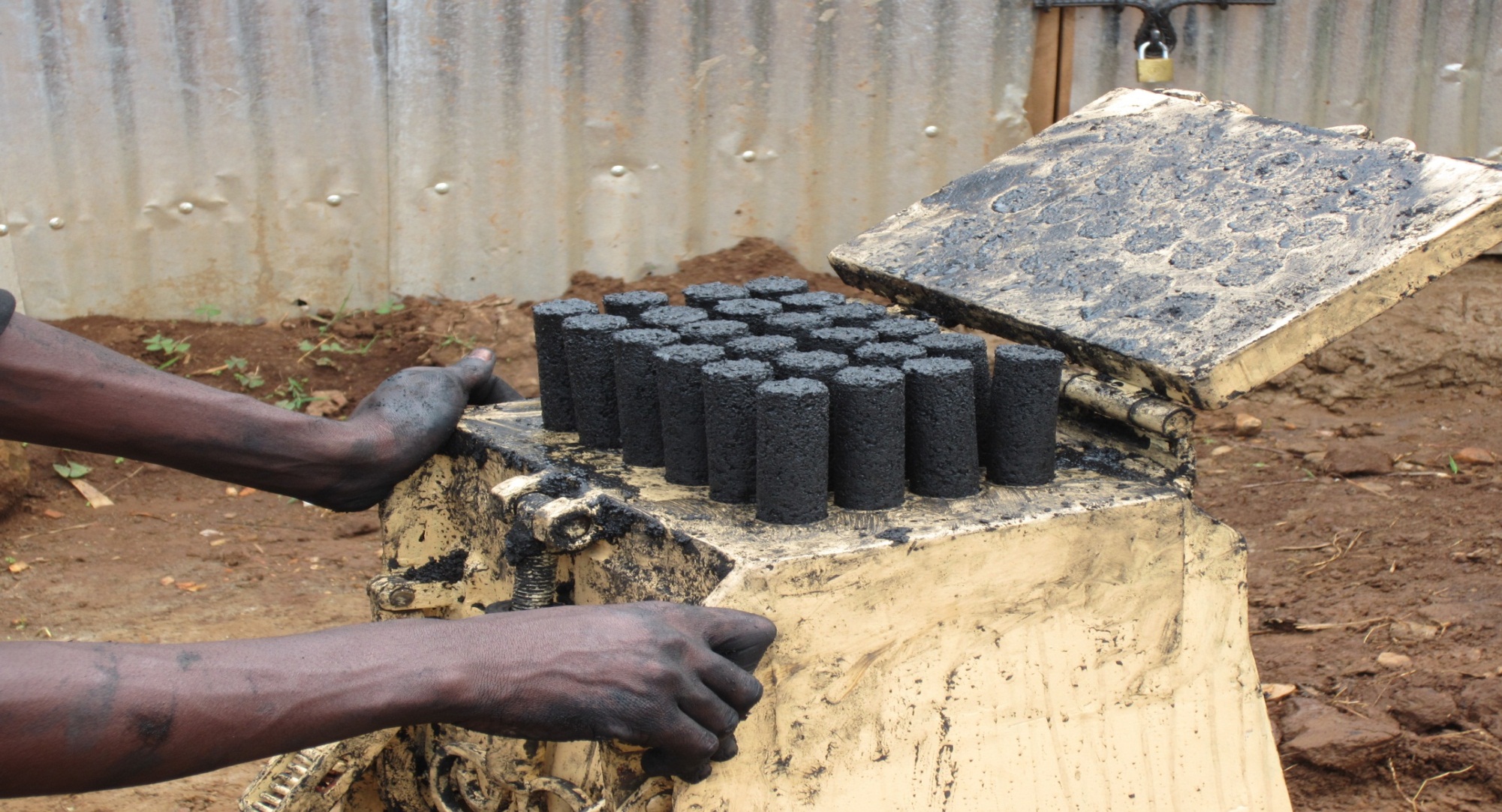 The press machine forms briquettes of biochar fuel. Photo: Eco-fuel Africa