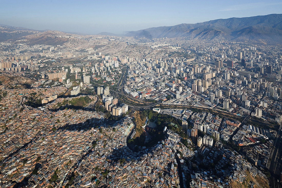 In Caracas, the capital of Venezuela, nearly seventy percent of the population lives in slums that seem to drape over every corner of the city.  