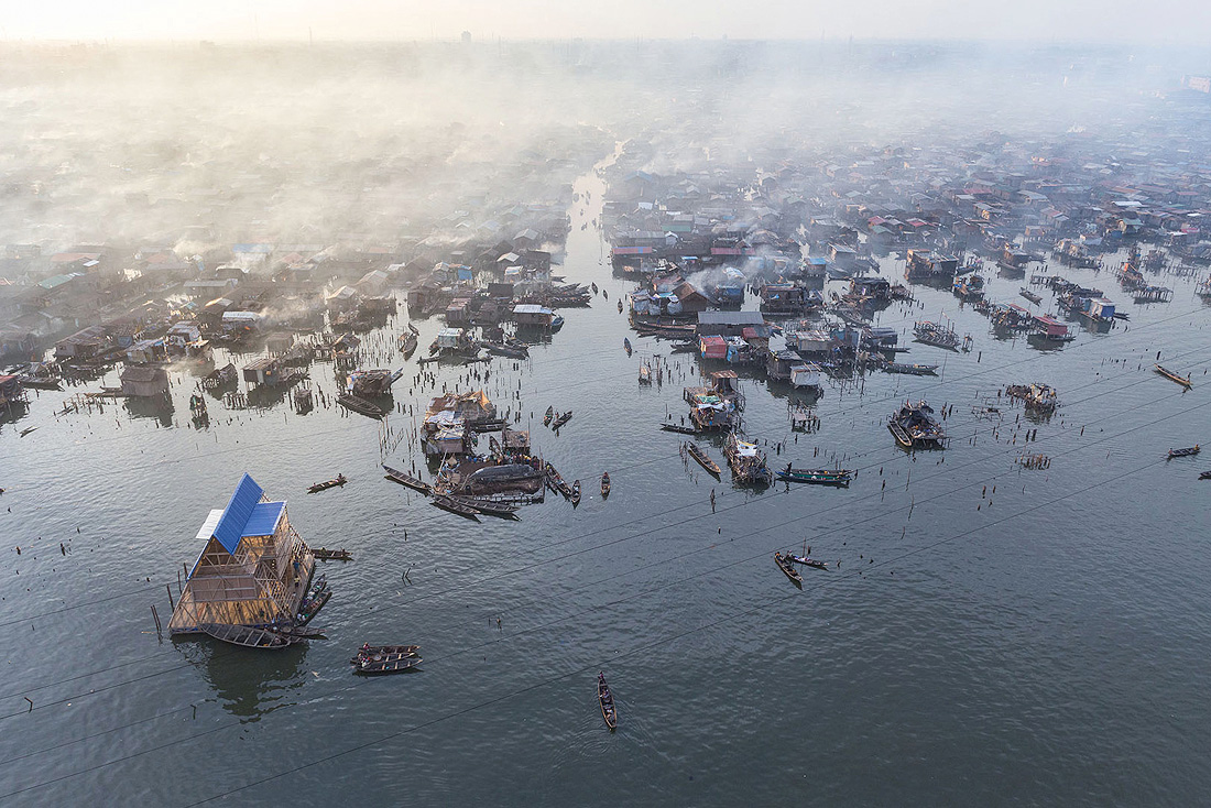 In Makoko, forced evictions are a daily reality. In response to the government’s plan to clear out the area to make room for development, the Nigerian Architect, Kunle Adeyemi built a school for the children of Makoko. Today, the entire community uses the structure, and the building appears like a beacon against the landscape. 