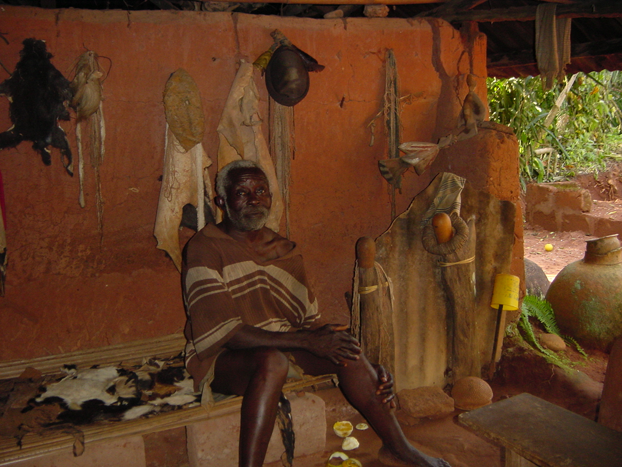 Mr. Ezeja Atama: the atama (chief priest) Ugwuojome of Nsukka sitting inside his shrine. Such priests examine the motions of heavenly bodies to come up with the calendar of her people. Photo: Johnson Urama 