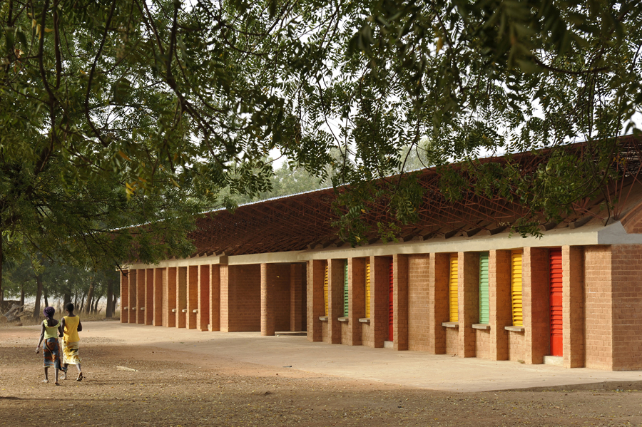 By 2007, more than 280 students from Gando and its surrounding villages had enrolled at the primary school and the community realized that the school would need more room. Once again, the community contributed to building an extension, working with their hands to created the colorful windows and vaulted ceiling. The building was completed in 2008. Photo: Erik-Jan Ouwerkerk