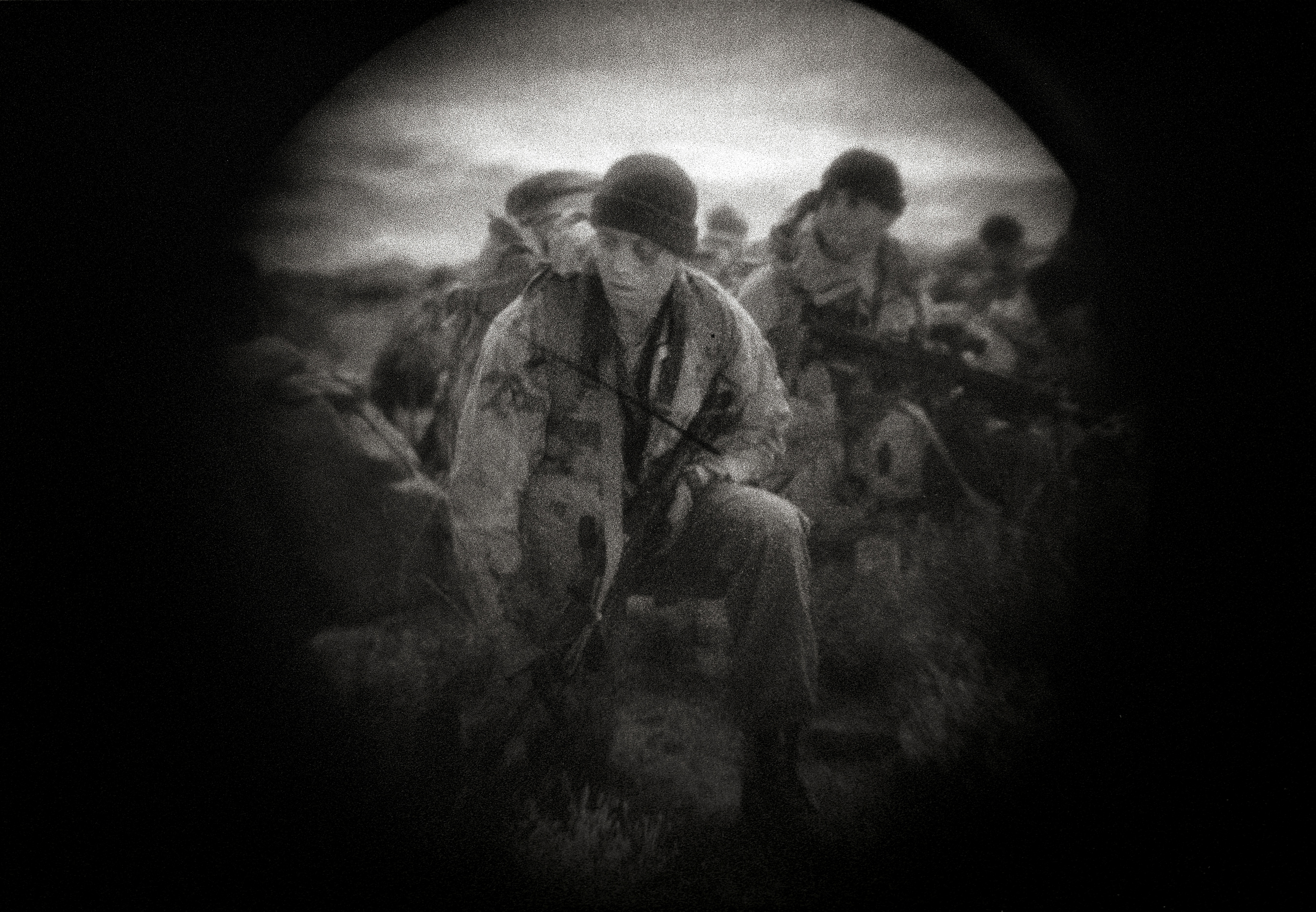 A night training operation by the United States Border Patrol Special Response Team Training in New Mexico. The photograph was made through night vision glasses.