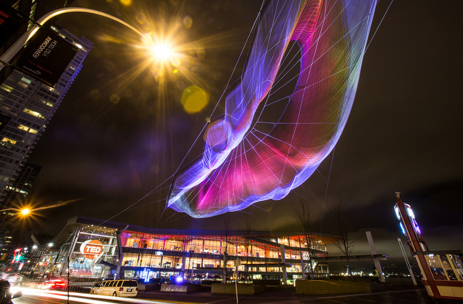 "Skies Painted with Unnumbered Sparks" is a sculpture by Janet Echelman with an interactive artwork created in collaboration with Aaron Koblin. This incredible sculpture flies is the sky outside TED2014. Photo: Bret Hartman