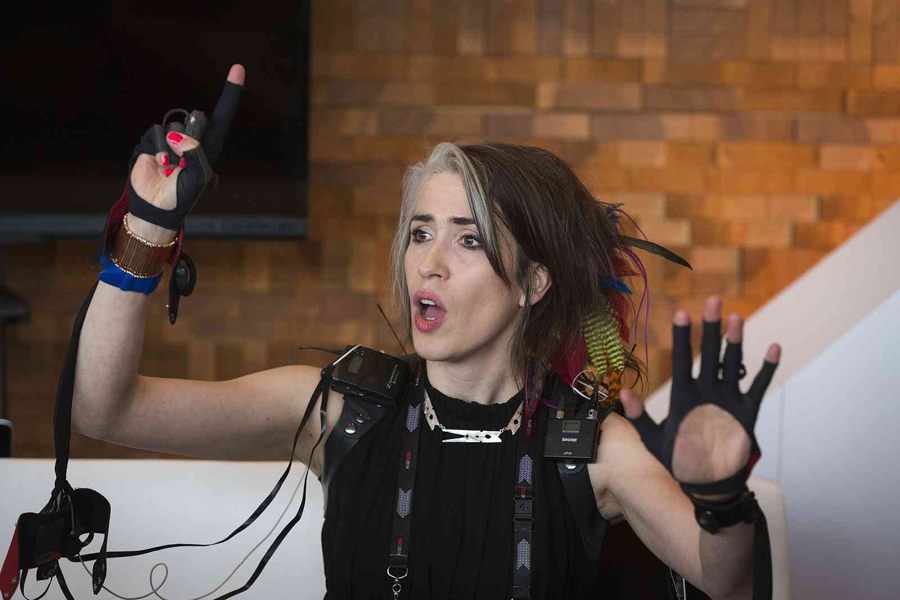 Imogen Heap visits the Jawbone Internet of You Café, to demo her musical gloves. The gloves let her activate music around her, and even change the treatments on her captivating voice. Photo: Bret Hartman