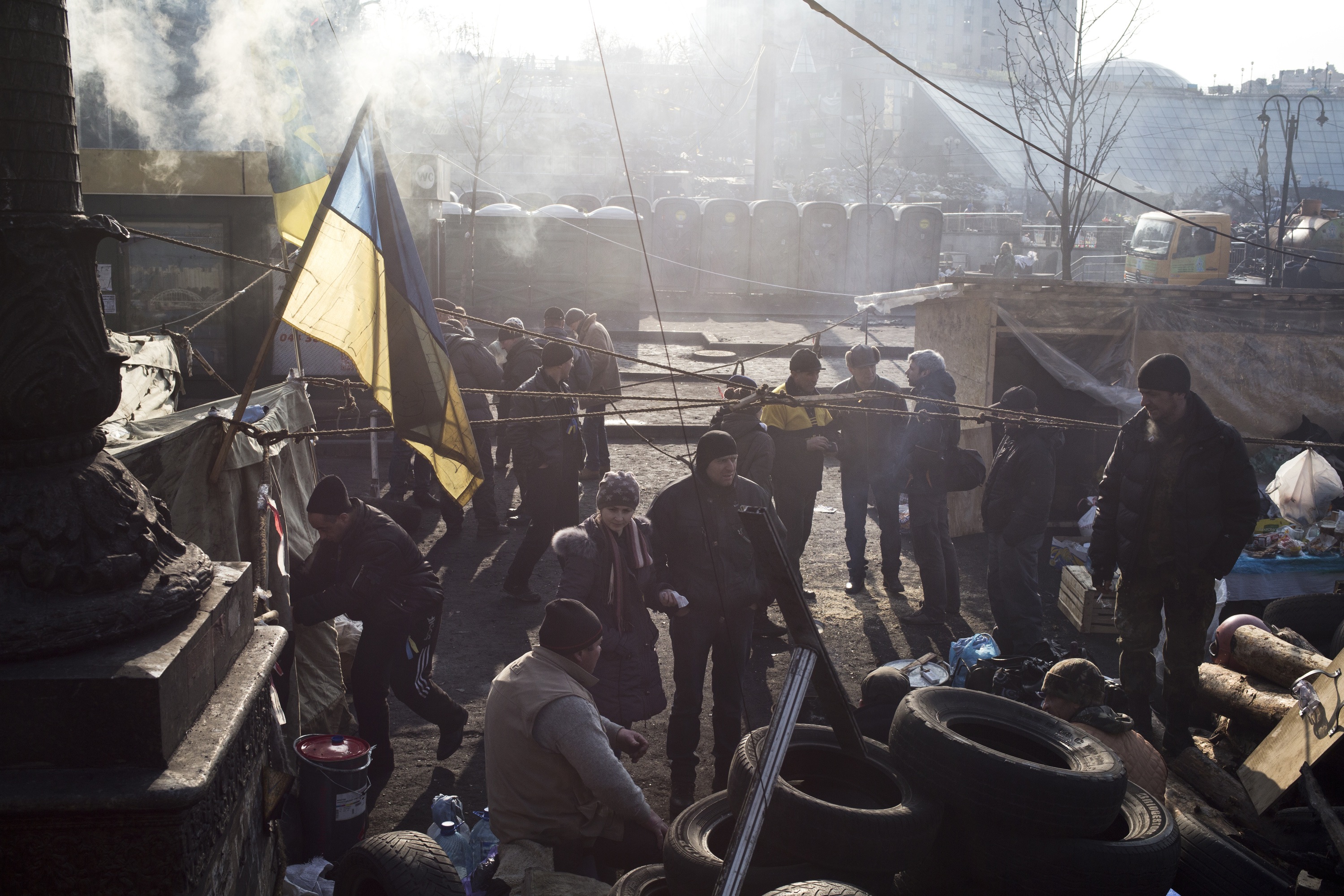 Anti-government protesters stand near barricades and tents during a sit-in of Independence Square in Kiev, Ukraine on Feb. 24, 2014. (Ed Ou/Reportage by Getty Images) 