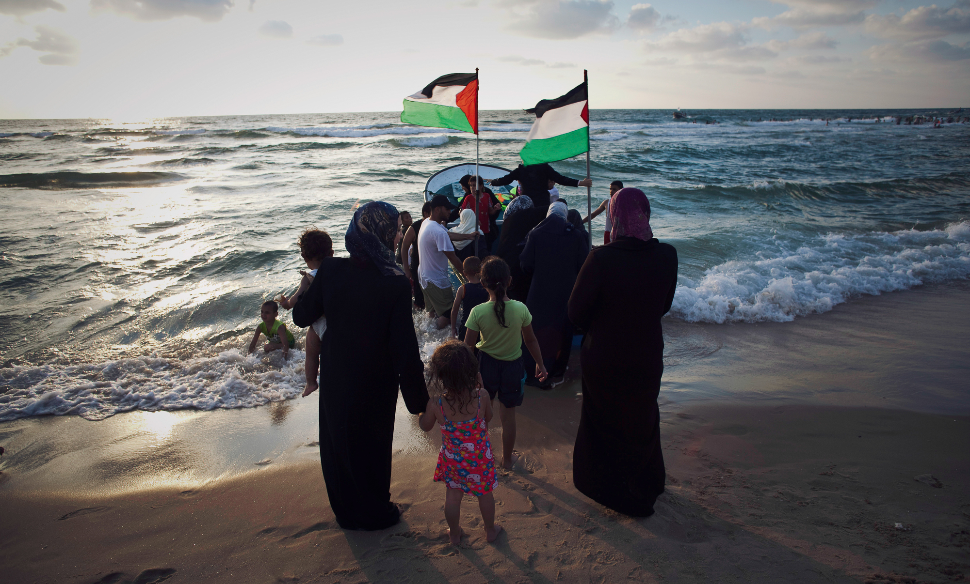 Palestinian women and children waiting for their turn for a boat ride in Gaza's sea. Photo by Eman Mohammed/Getty Images for WHAT'S NEXT