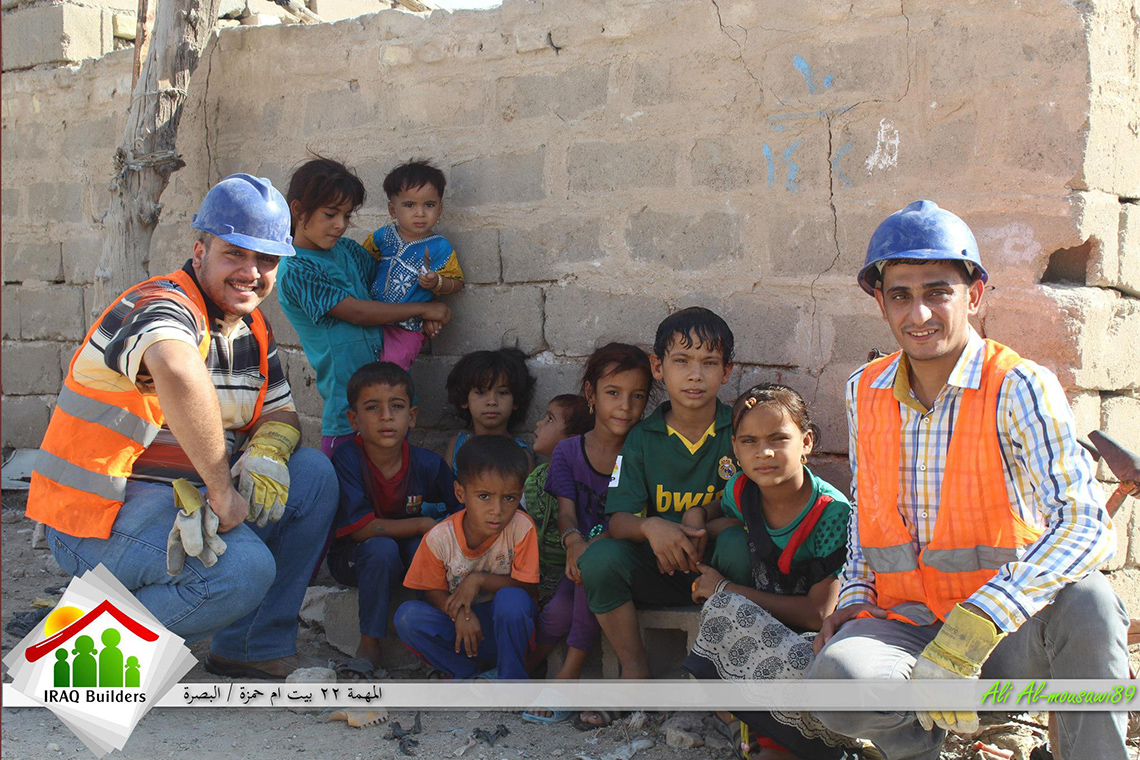 Elaf Mohammed (left) poses with the children whose home the team helped rebuild in Basrah. Photo: Courtesy of Iraq Builders