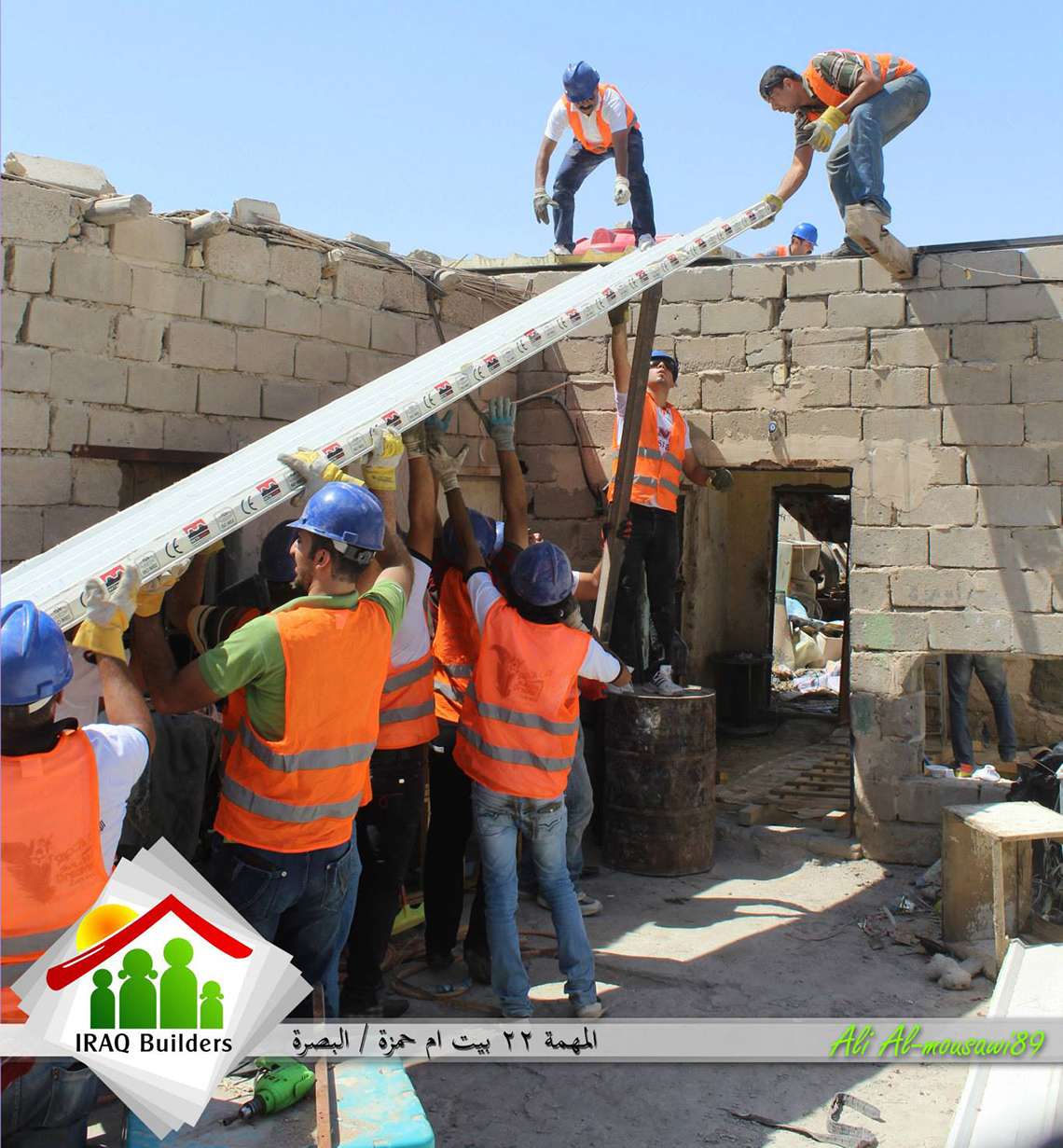 A team from Iraq Builders puts a new roof on a bombed-out home in Basrah, Iraq last August. Photo: Courtesy of Iraq Builders