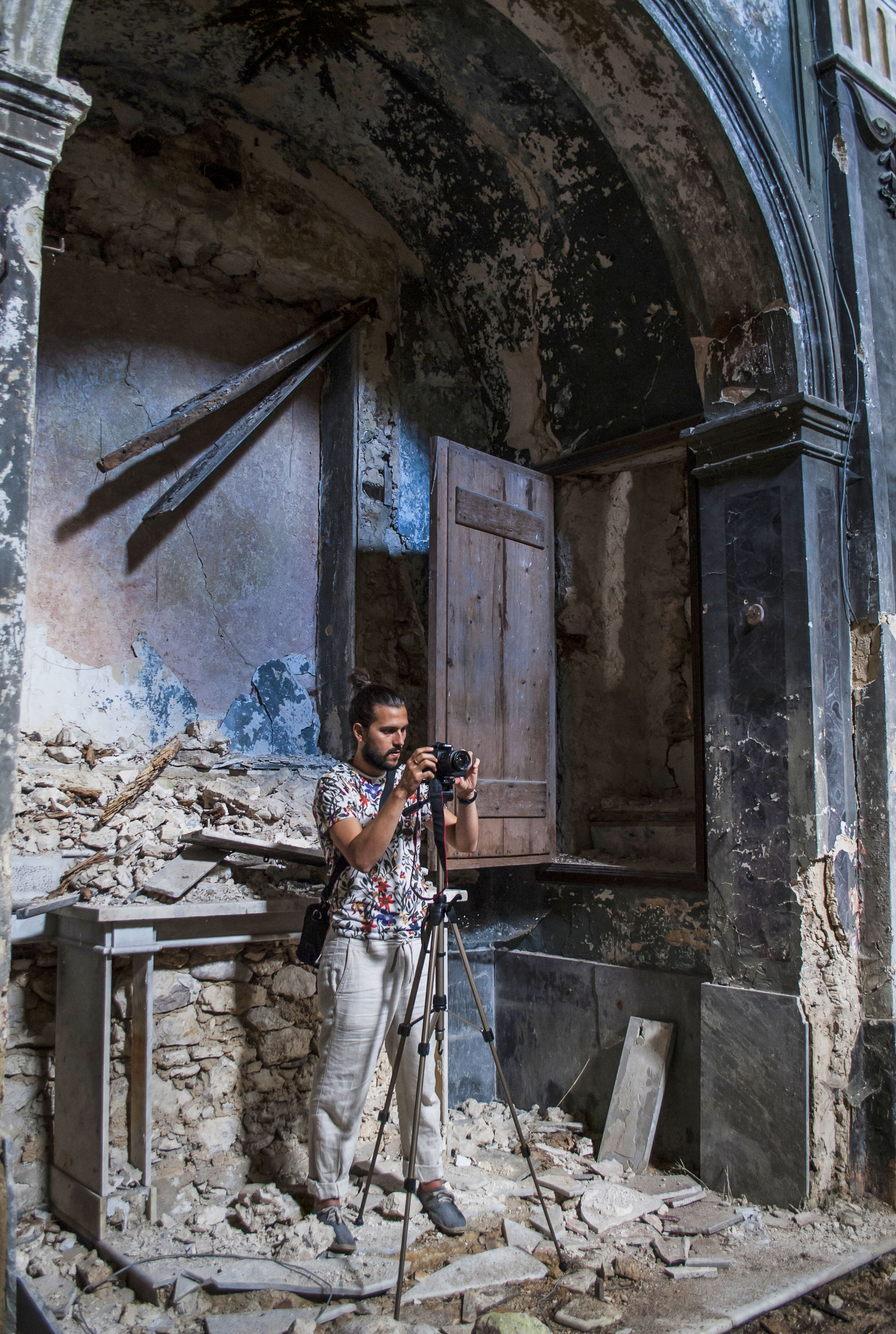 Here, Rubio sets up a shot in an Italian church devastated by an earthquake. Photo: Courtesy of Rubio