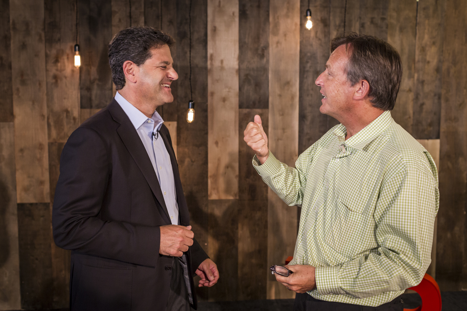 Nick Hanauer and TED Curator Chris Anderson are both "really bad at holding grudges." Here, the two talk before an in-office event. Photo: Ryan Lash