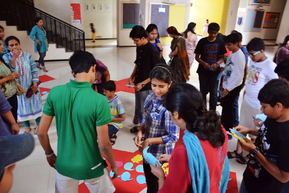 In a group activity for a TEDxPune salon at The Orchard School, students wrote responses to “What inspires you?” on to colored paper. Organizer Abhishek Suryawanshi plans to organize a salon in a local prison next. Photo: Courtesy of TEDxPune