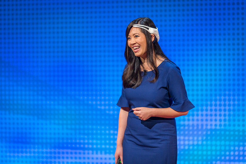 Tan Le wore a headset on stage that allowed attendees to look at her brain activity, live. Photo: Marla Aufmuth/TED
