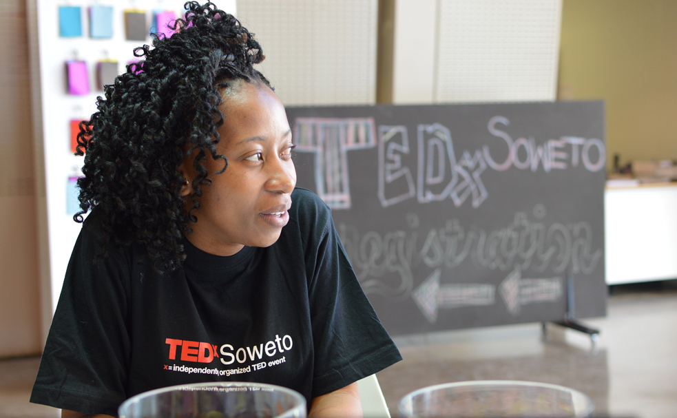 A volunteer mans the registration table at TEDxSoweto. Photo: Courtesy of TEDxSoweto