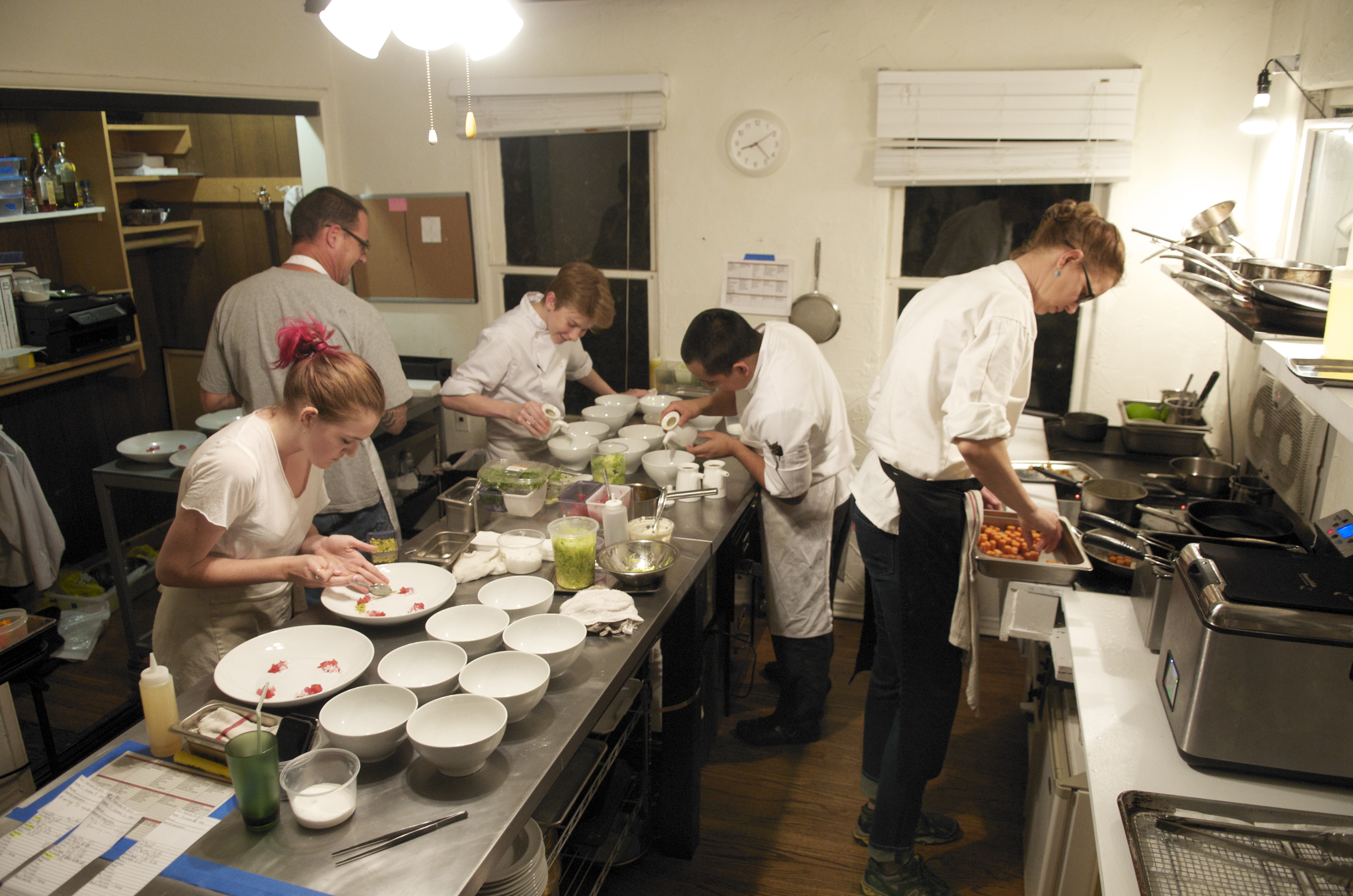 Chef Flynn McGarry, just 15-years-old, supervises plating at EUREKA, his monthly supper club that now has a cult following.