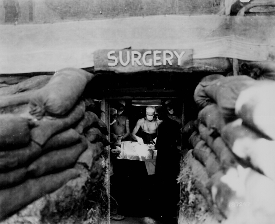 (The late 1940s) “Hero surgeons” + plastic = big advances. The years following World War II saw a huge increase of new biomaterials and techniques for using them. Buddy Ratner attributes this to two factors. Firstly, that surgeons on the battlefield were given carte blanche to try new things to save their patients, and many of these so-called “hero surgeons” got creative. Secondly, plastics became widely available. “It was a seminal moment,” says Ratner. “During the war, many of the plastics we take for granted were considered war necessities … Once the war was over and these were released, physicians saw a couple of very obvious reasons why plastics would be good. They're a lot easier to fabricate into shapes than metal. Plastics are light, and they have this wonderful quality of inertness.” Shown here, an American Army doctor operates on a U.S. soldier wounded by a Japanese sniper in an underground surgery room, behind the front lines on Bougainville island, December, 1943. Image courtesy US National Archives.