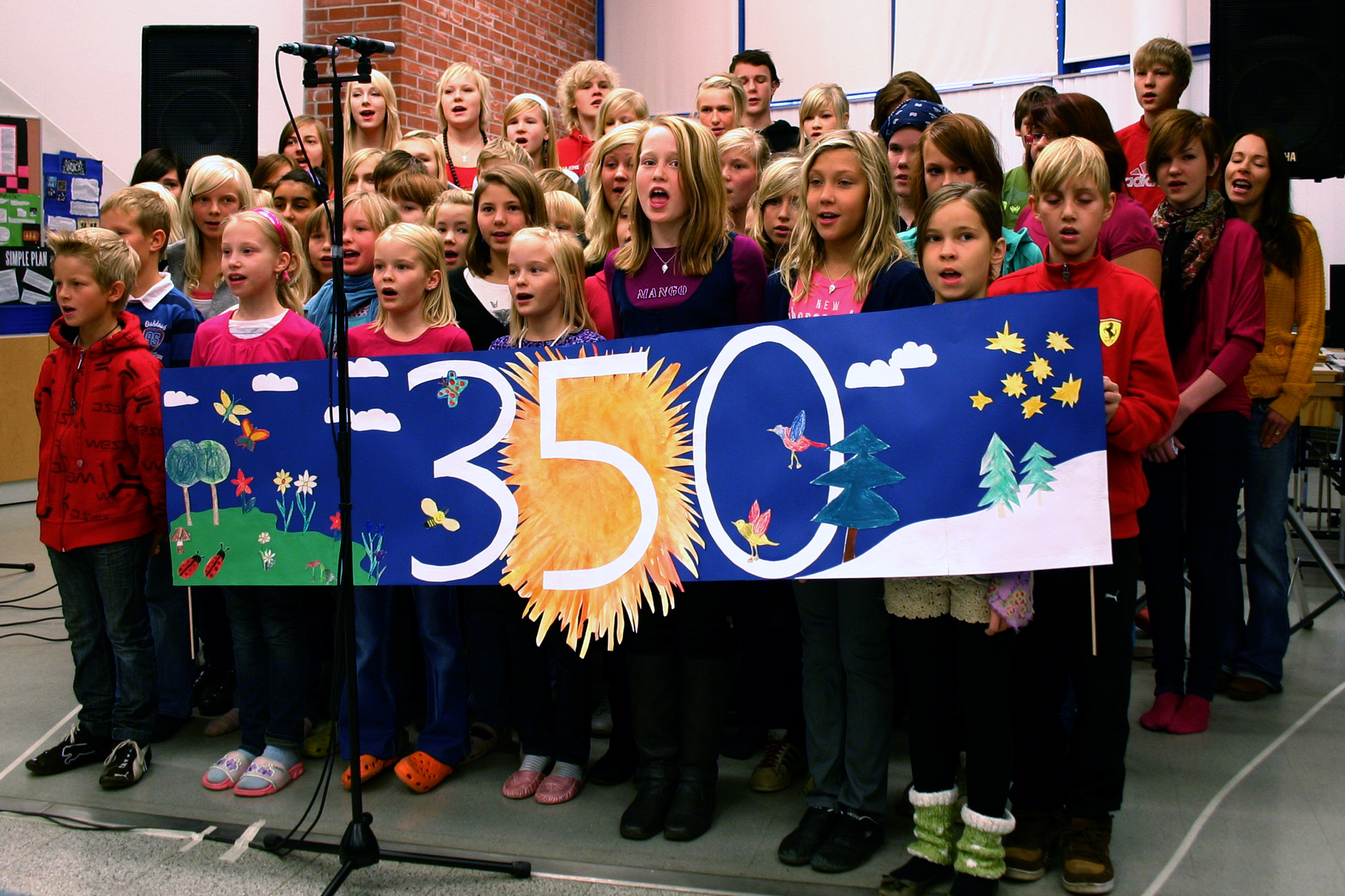 Children in a Finnish school choir perform a song called "The Time Is Now" on their Climate Action Day. Photo by Aapo-Lassi Kankaala/Flickr. https://www.flickr.com/photos/350org/4040191008