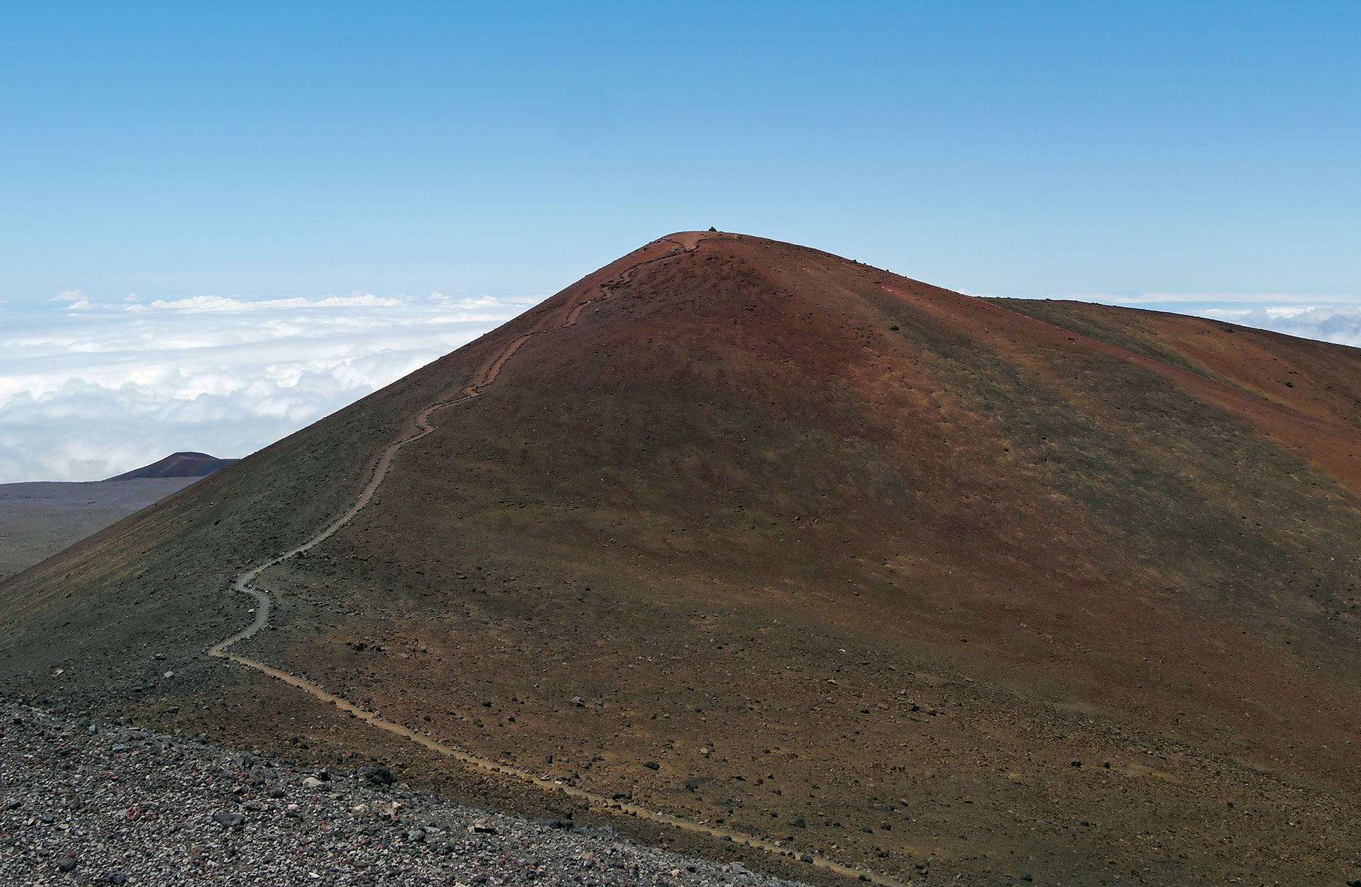 Mauna Kea Trail to the summit of Mauna Kea, Big Island, Hawaii. The cinder cone that is the highest point (13,796 feet) is called Pu'u Wekiu. 