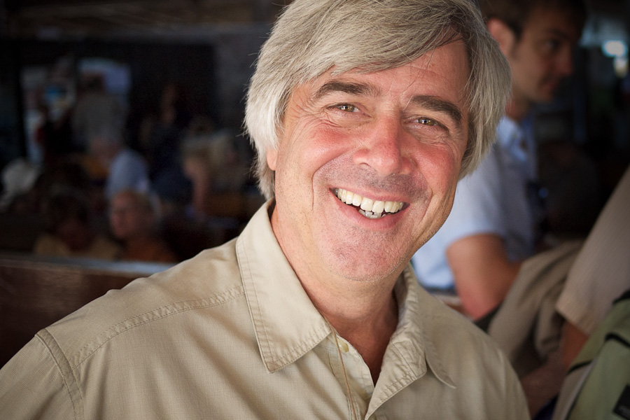 Mike deGruy, smiling while in line at Baltra Airport in the Galápagos Islands, April 2010. Courtesy James Duncan Davidson.