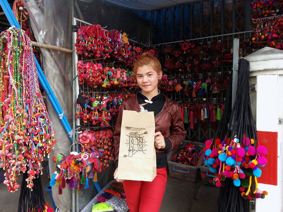 This resident of Chiang Mai, Thailand, filled a bag with colorful puff balls for a project designed to connect members of the community. Photo: TEDxChiangMai