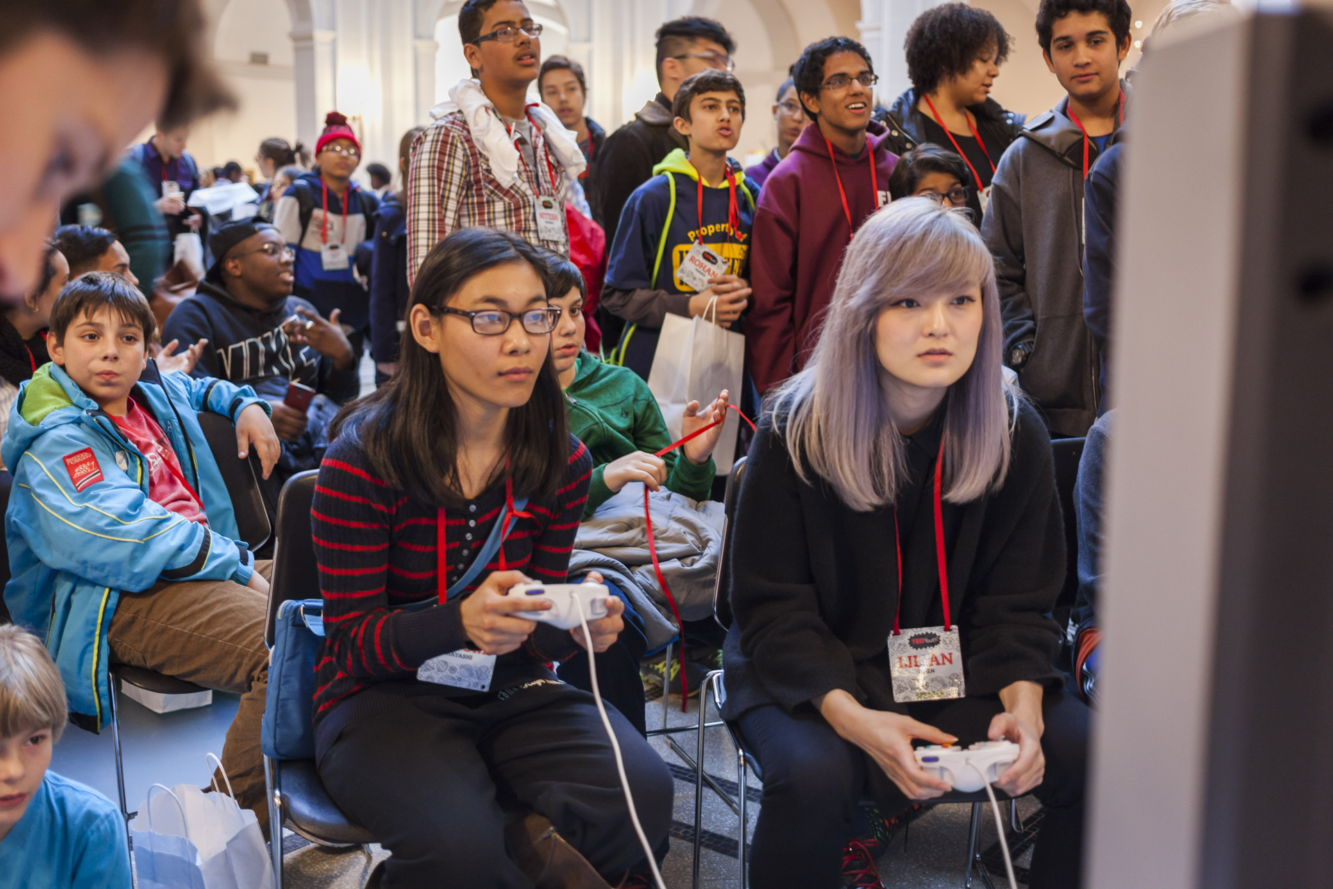Super Smash Bros. Melee champion Lilian Chen, also known as Milktea, plays against an attendee. Who actually lasted pretty long before being beat. Photo: Dian Lofton/TED