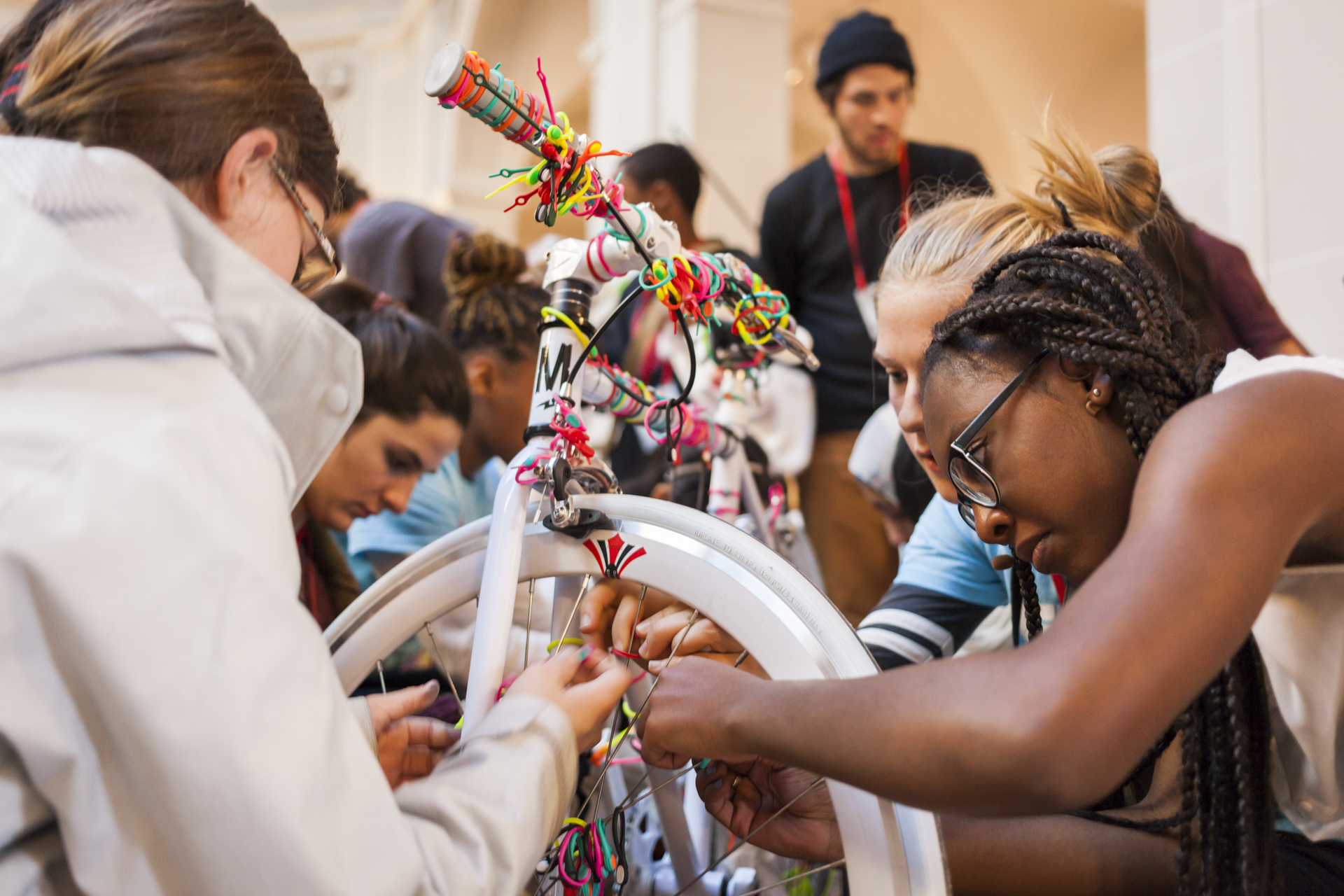 Attendees spiff up a bike with Hickies shoelaces. Photo: Dian Lofton/TED