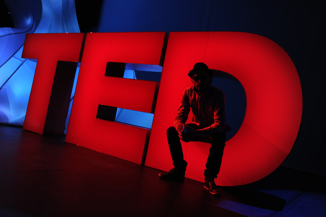 TED Prize Winner JR is an amazing photographer with an identity that he tries to keep at least somewhat undercover. I never photograph him without his sunglasses on, but I wanted to make a photo of his time on the TED stage that captured the man in a different way than as a speaker. So I talked him into sitting in the D and posing for me in the red light. To me, this is JR at TED. Photo: James Duncan Davidson/TED