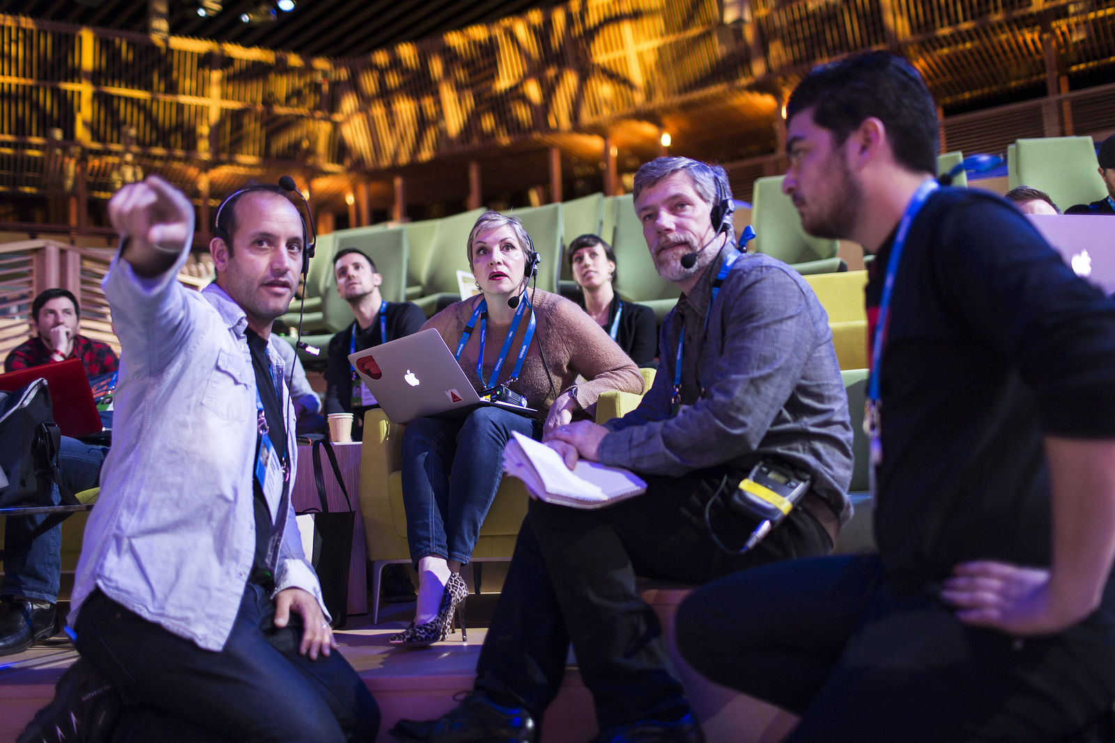 In the TED theater, the crew  has a conversation about stage direction. Photo: TED