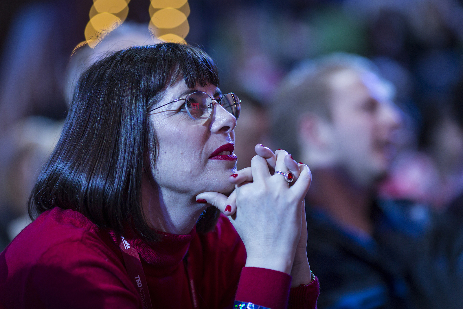 A TEDx organizer is entranced watching a speaker rehearsal. Photo: