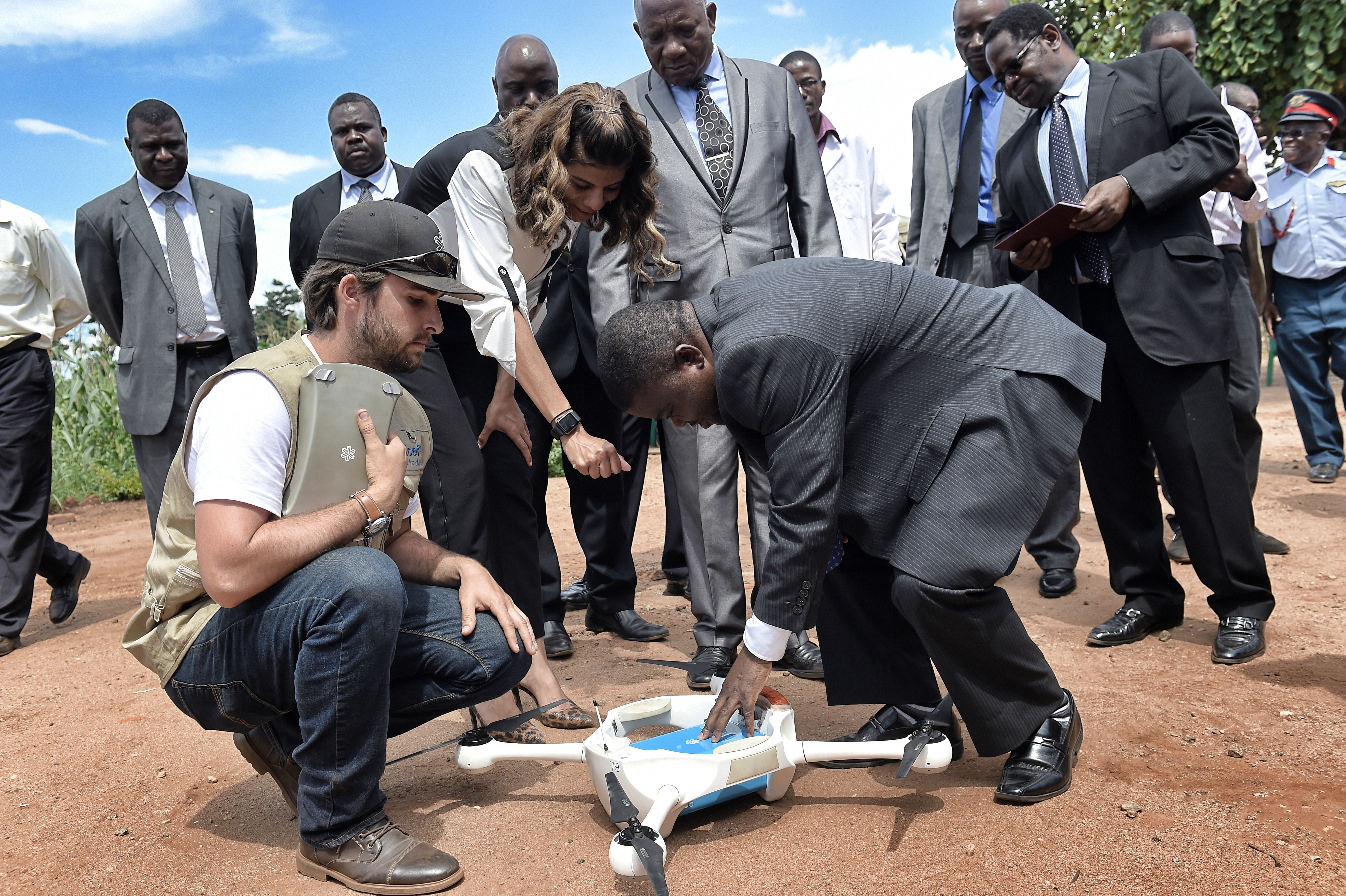 On the day of the inaugural test launch at Kamuzu Central Hospital, Dr. Peter Kumpalume, Malawi’s Minister of Health, works with drone technician Brandon Landry to get ready for launch. 