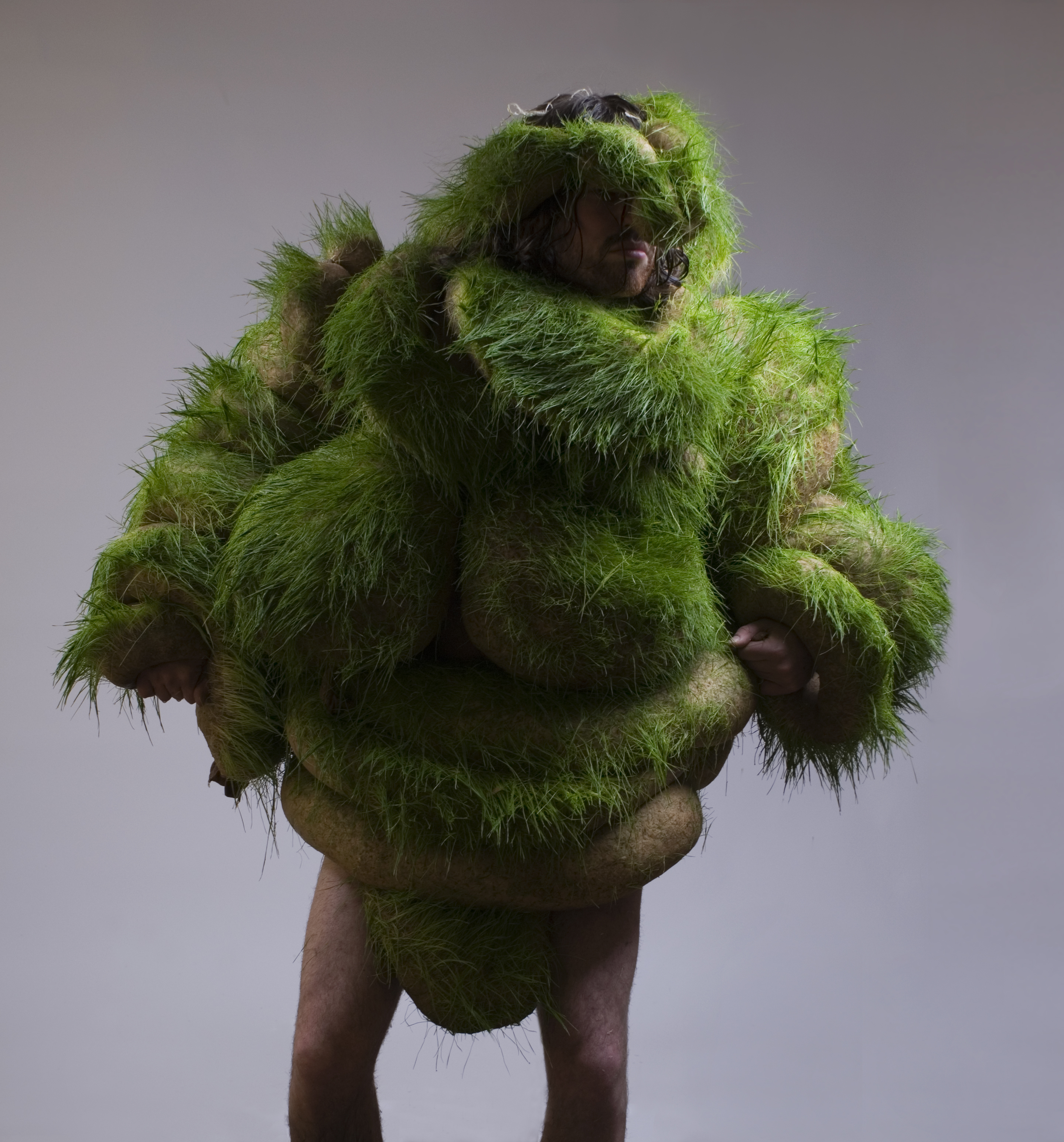 Australian body architect Lucy McRae explores the relationship between the body and technology using synthetic and organic materials. This project, Germination Day 8, was created from pantyhose, sawdust and grass seed.