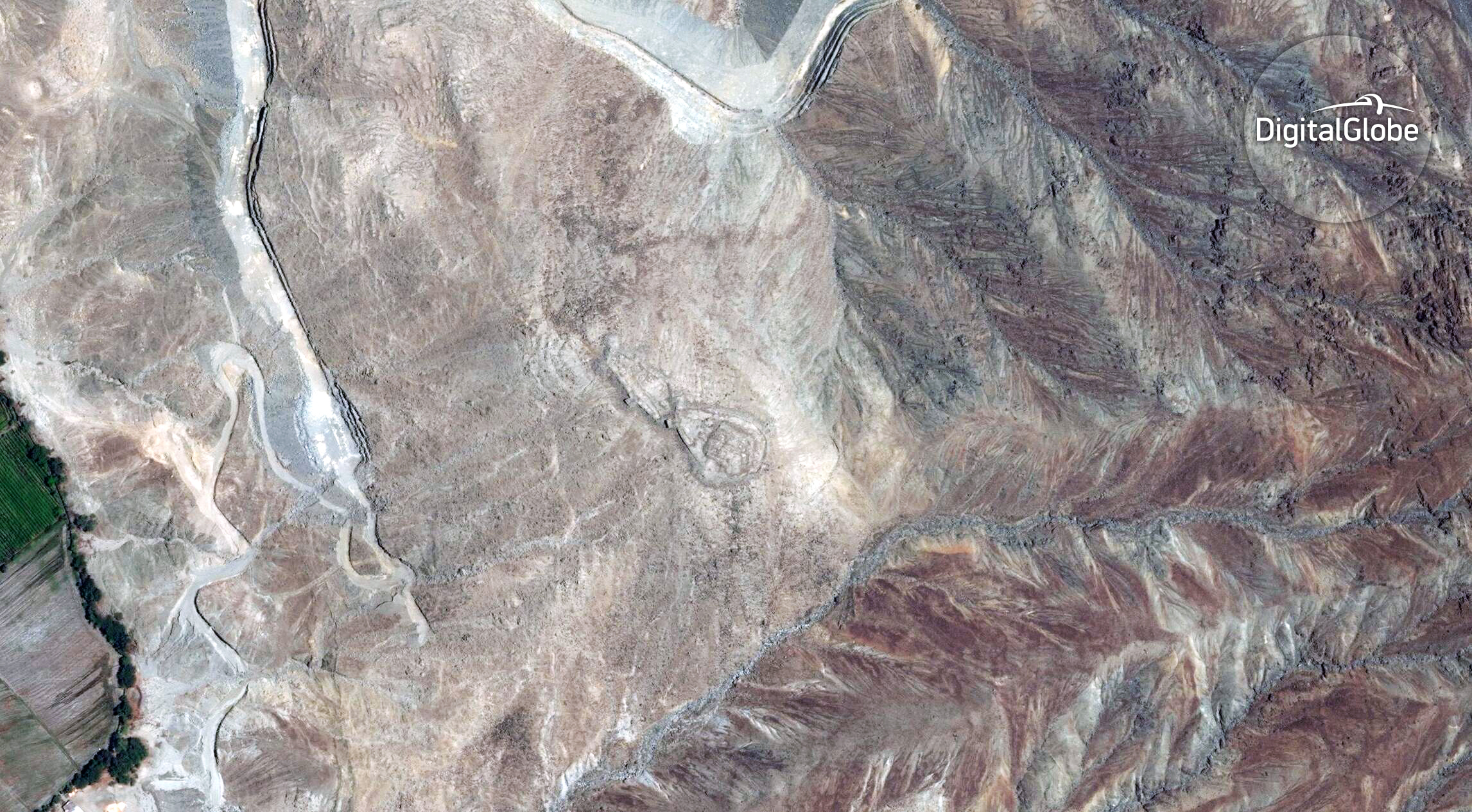 Users will search more than 200,000 square kilometers of satellite imagery. Large sections like this will be broken into smaller tiles — and archaeological features like this stone structure on a hill in Peru's highlands. Image: ©DigitalGlobe 2017