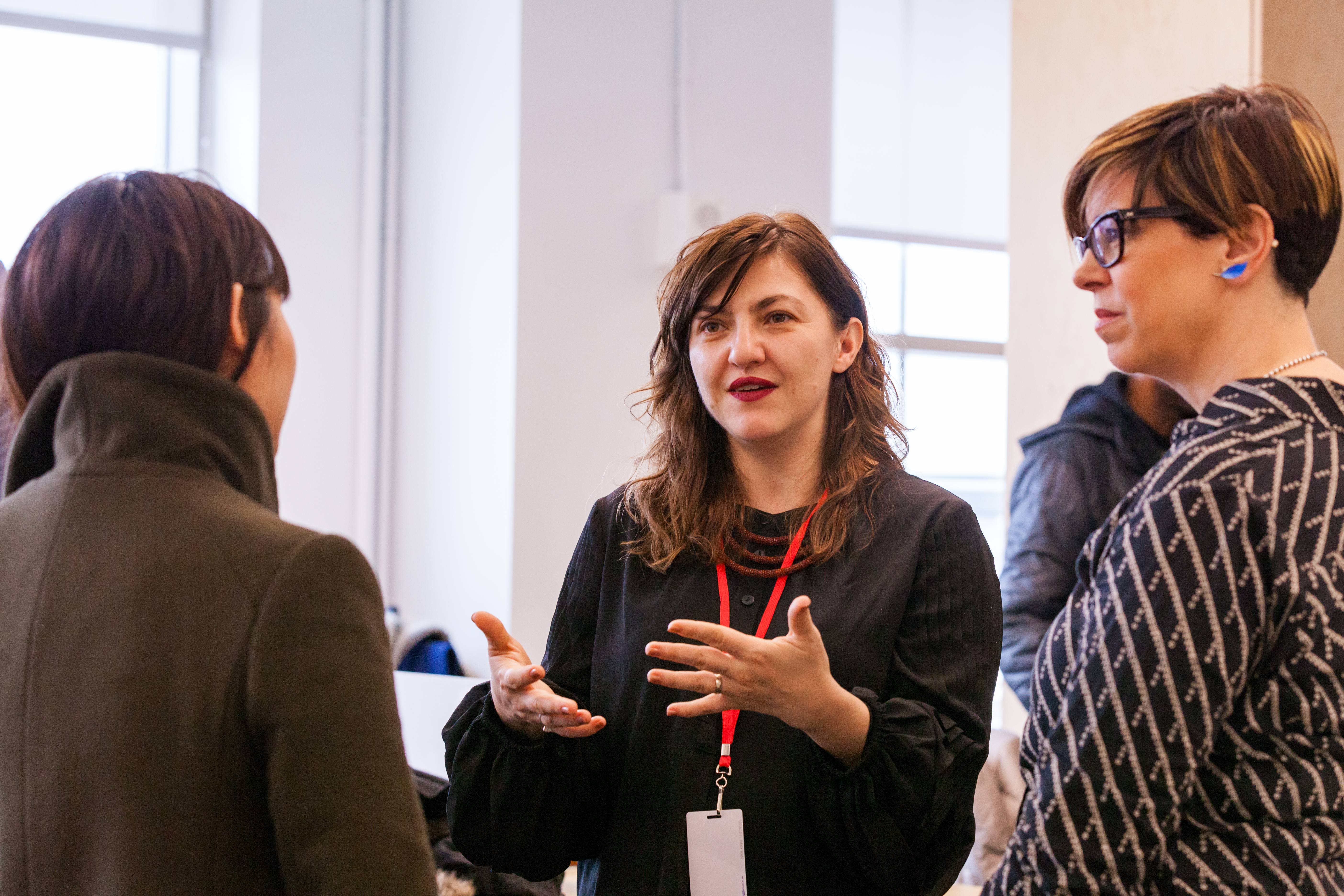 Playwright and technologist Kat Mustatea (center) introduces herself to former Residents Amanda Phingbodhipakkiya and Danielle Gustafson during the TEDStart meet-and-greet event that kicked off the new Residency season. Photo: Dian Lofton / TED