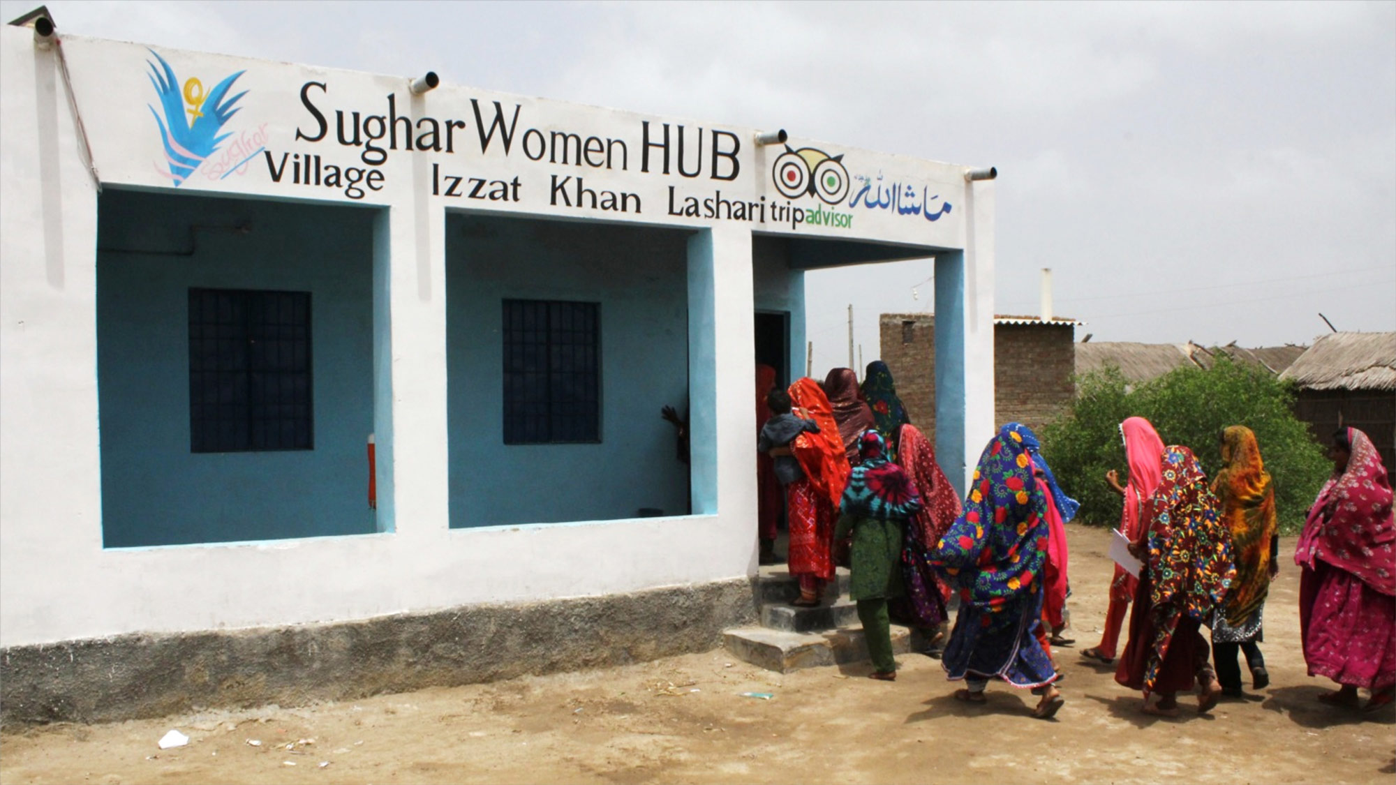 Women enter a Sughar Center. 