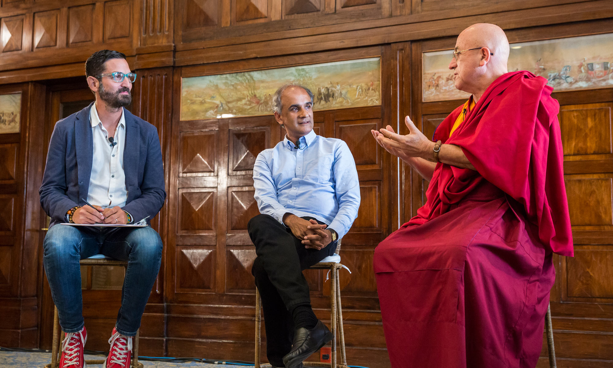 Guy Raz (left), Pico Iyer (center), and Matthieu Ricard (right) discuss mindfulness and the importance of being still at TED Global 2014. Photo by Duncan Davidson/TED.