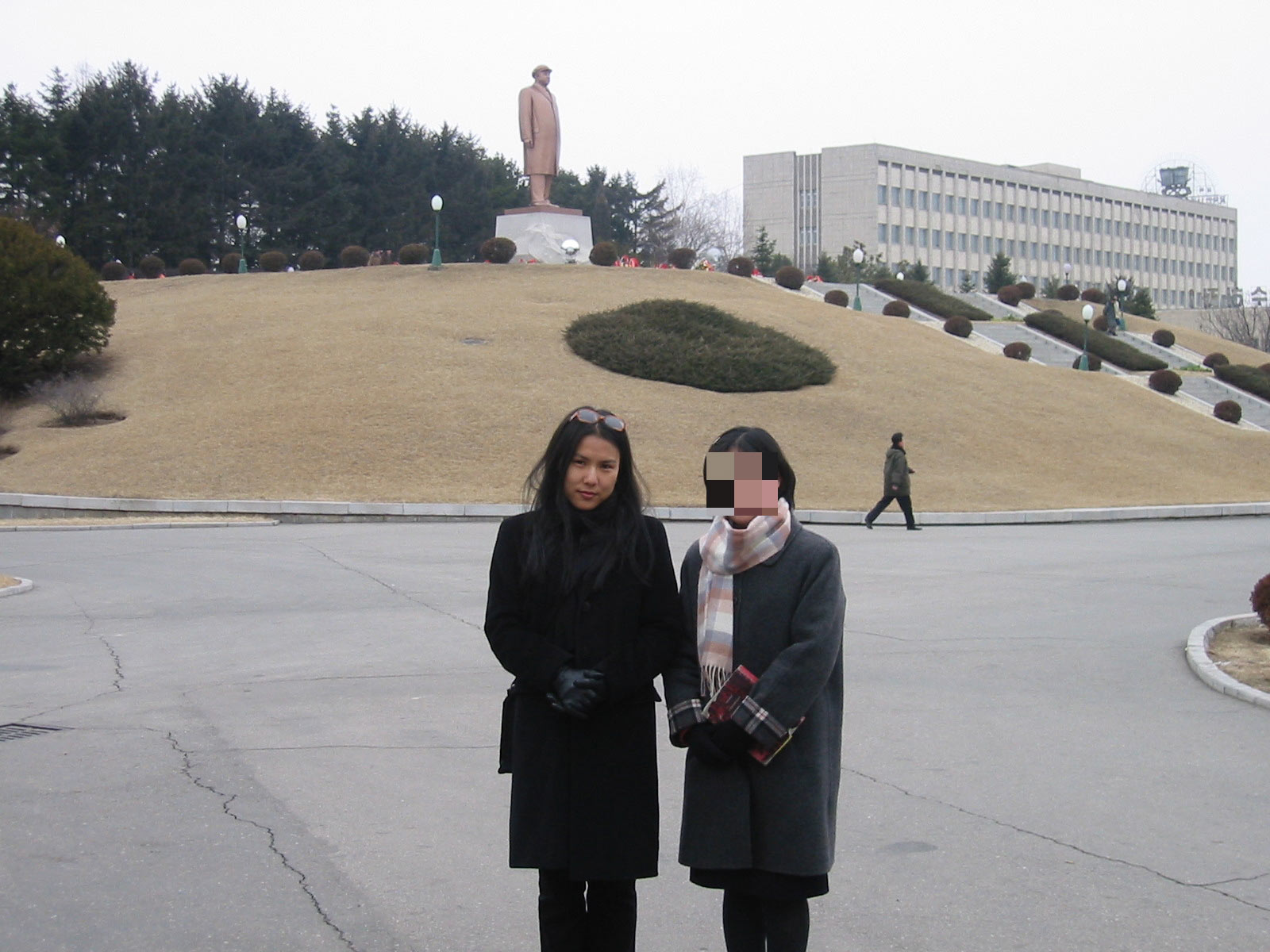 This photograph was taken with a North Korean student at Kim Il-sung University campus. Note the statue of Kim Il-sung, who ruled North Korea from 1948 until his death in 1994.