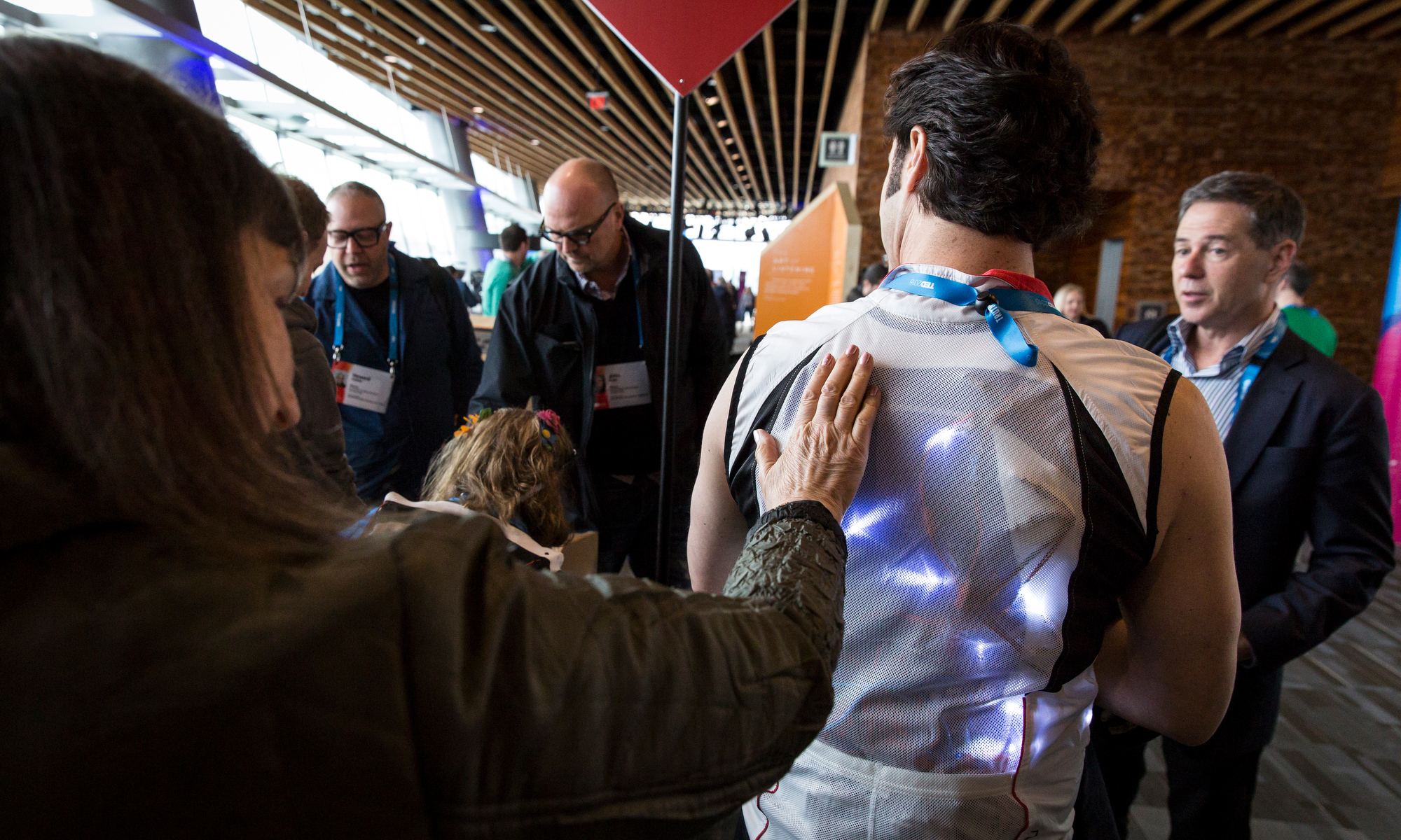 Attendees get a hands-on look at David Eagleman's vest at TED2015 - Truth and Dare, Session 2, March 16-20, 2015, Vancouver Convention Center, Vancouver, Canada. Photo: James Duncan Davidson/TED