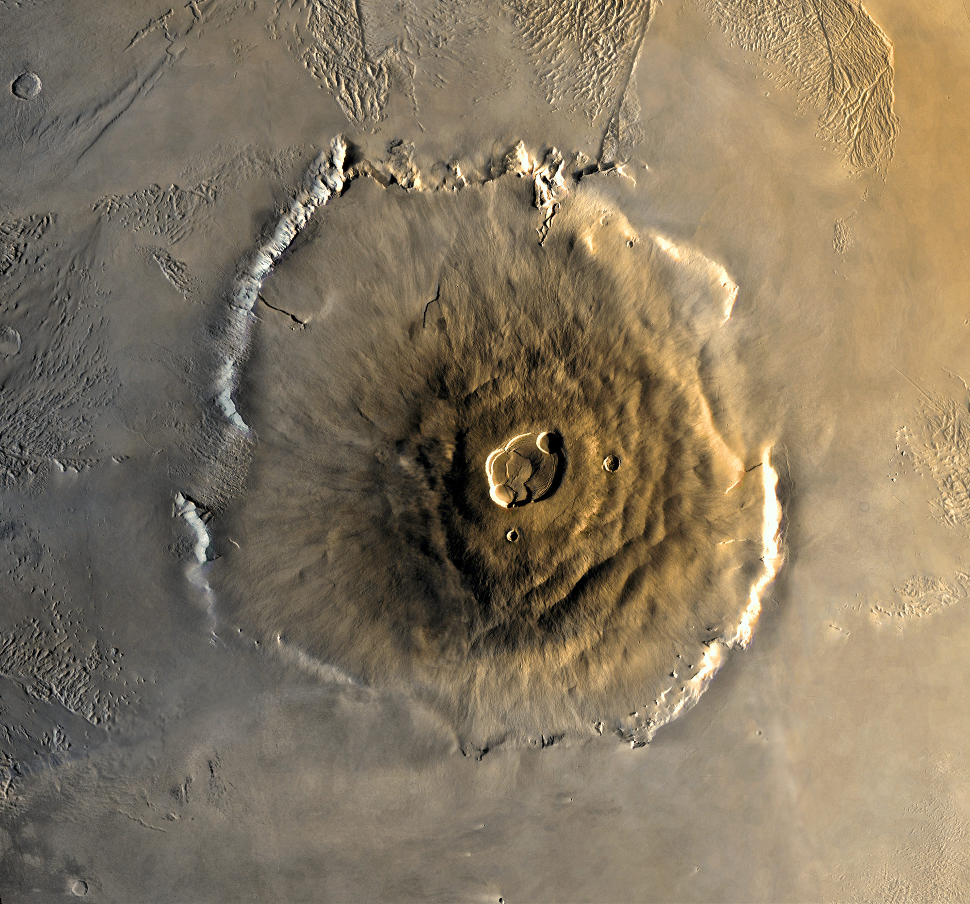 Photo: NASA/JPL. "The tallest known volcano and mountain in the solar system, Olympus Mons." 