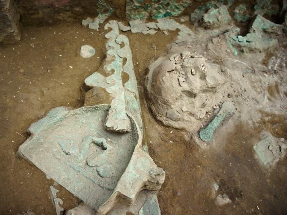 A funerary mask of copper is uncovered near the priestess-queen's skull. Photo courtesy of Luis Jaime Castillo Butters.