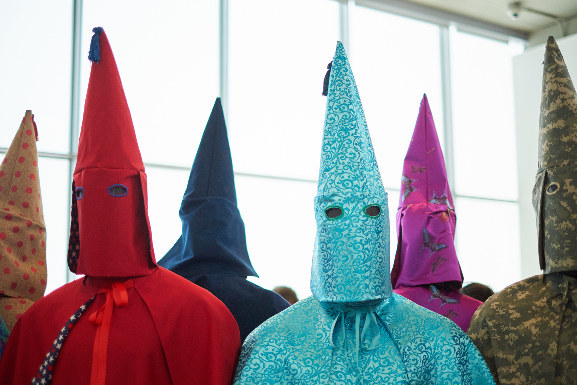 Image of Children in Ku Klux Klan costumes pose with Ku Klux